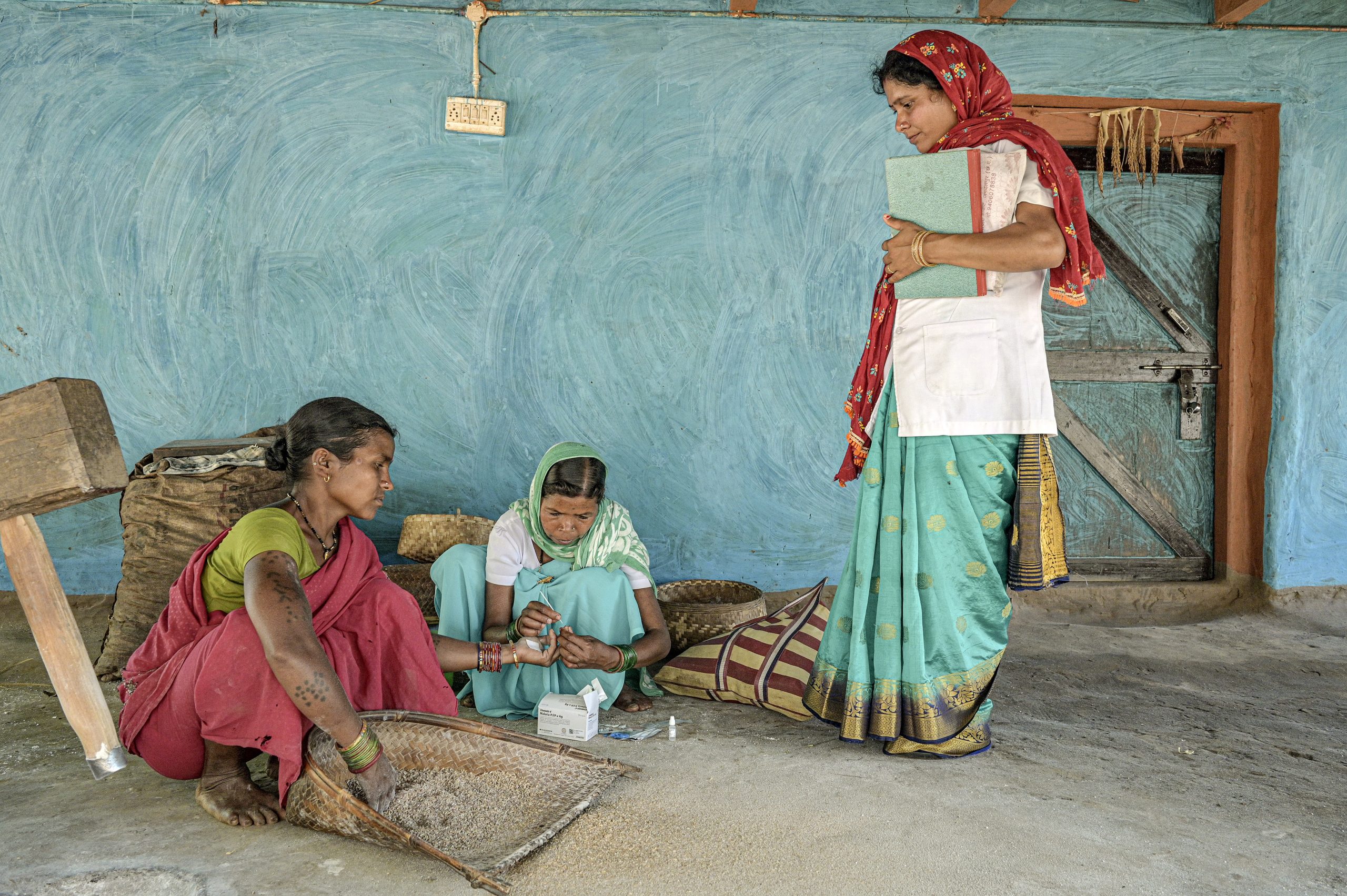 Daymati is tested for malaria by health workers in Kadampara village as a part of malaria surveillance activities in Bastar district, Chhattisgarh. Members of the community with suspected cases of malaria receive a rapid diagnostic test (RDT), which allows for quick results within 15 to 30 minutes. In recent years, India has made impressive gains in reducing its malaria burden, with cases dropping by more than 40% between 2015 and 2021. Most of the remaining cases are concentrated among tribal populations living in rural areas. This photo set describes efforts by local health workers to reach people at risk of malaria in remote areas of Chhattisgarh, a state that accounts for nearly one fifth of the countrys malaria burden. Related: https://www.who.int/news-room/photo-story/photo-story-detail/reaching-people-at-risk-of-malaria-in-remote-areas-of-Chhattisgarh-india